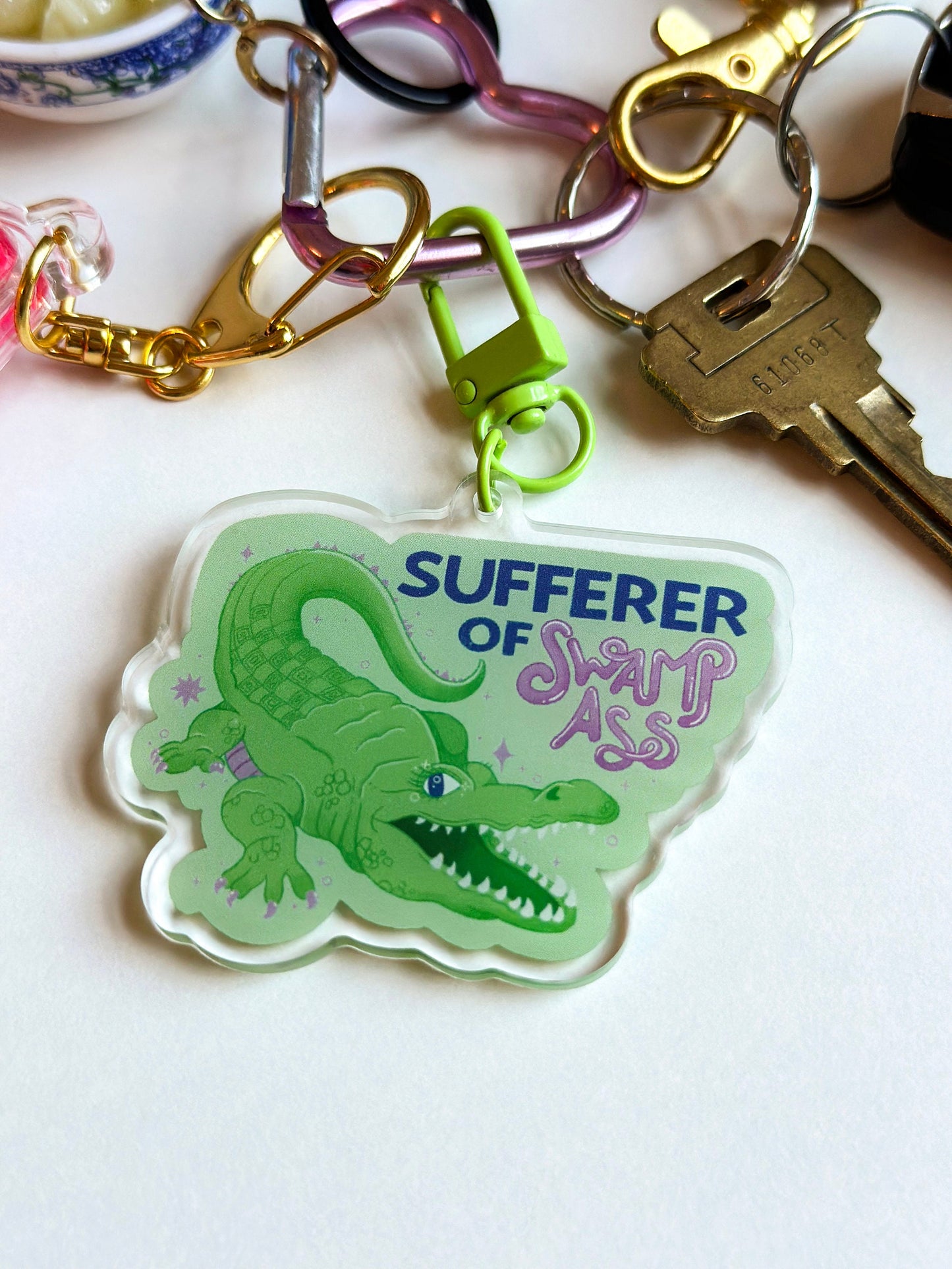 sufferer of swamp ass keychain
