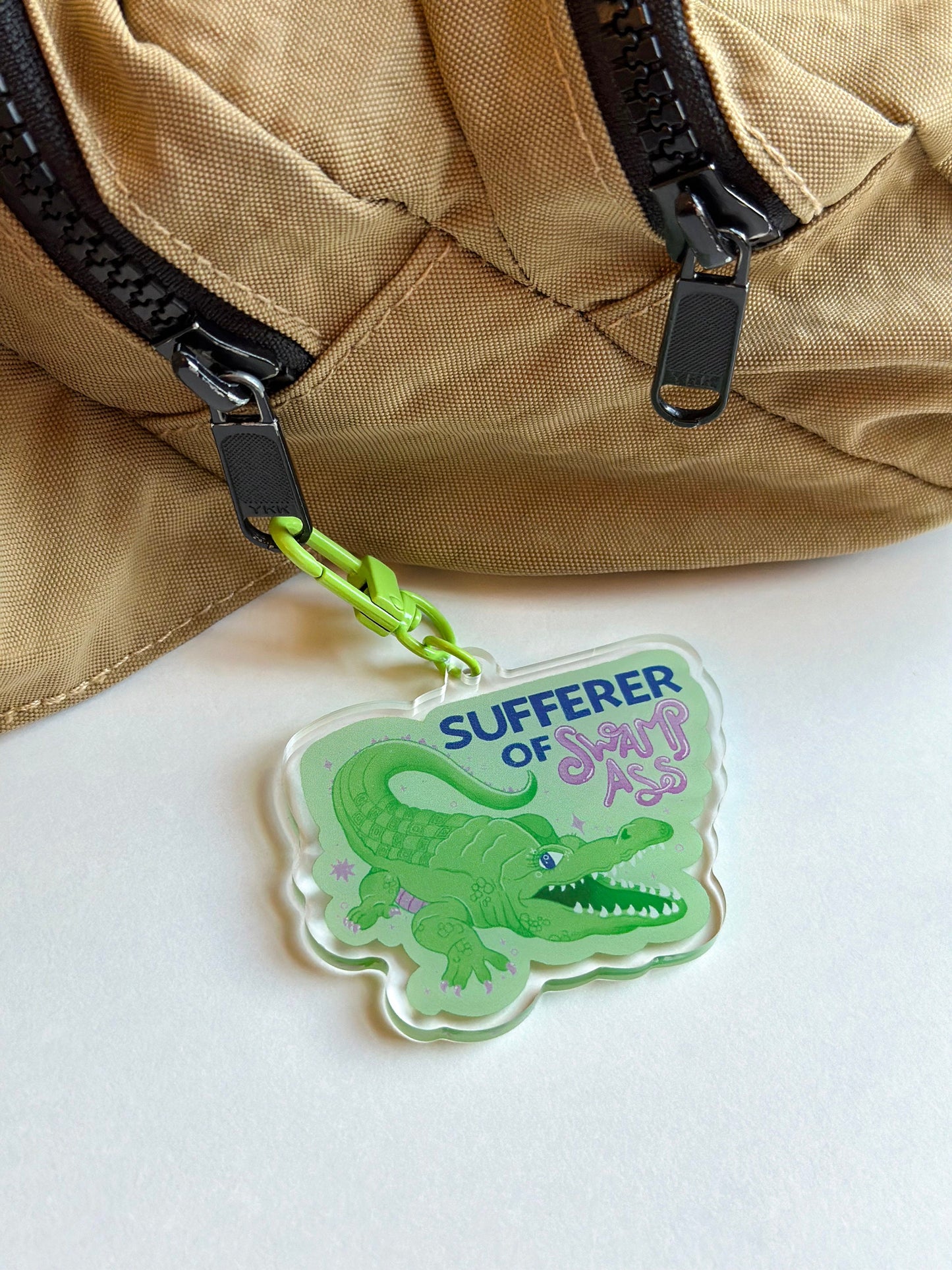sufferer of swamp ass keychain